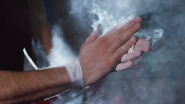 Gymnast chalking his hands — Stock Video