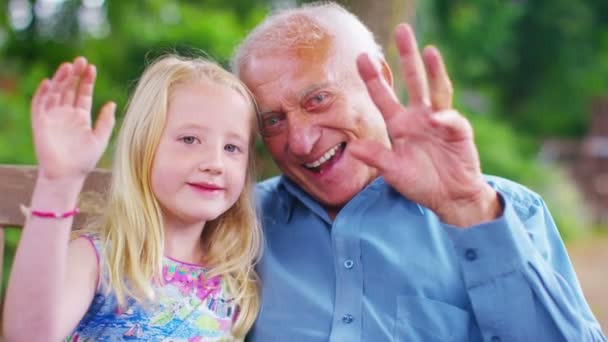 Grandfather and granddaughter make a video call — Stock Video