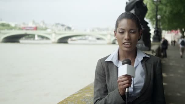 News reporter doing live piece to camera — Stock Video