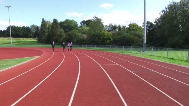 Businessmen racing each other at running track — Stock Video