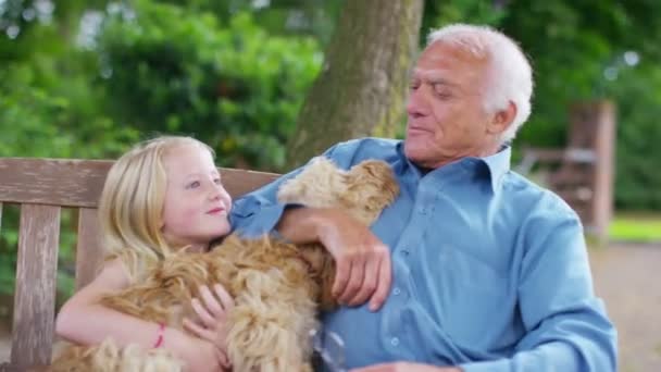 Grandfather and granddaughter with dog — Stock Video