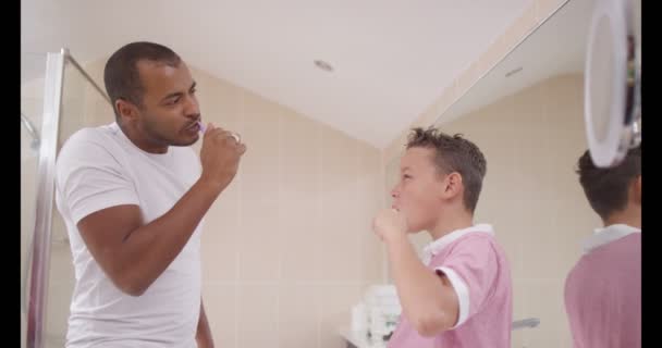 Father and son in bathroom in the morning