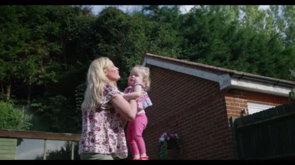 Mother and toddler in the garden — Stock Video