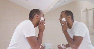 Father and son in bathroom in the morning