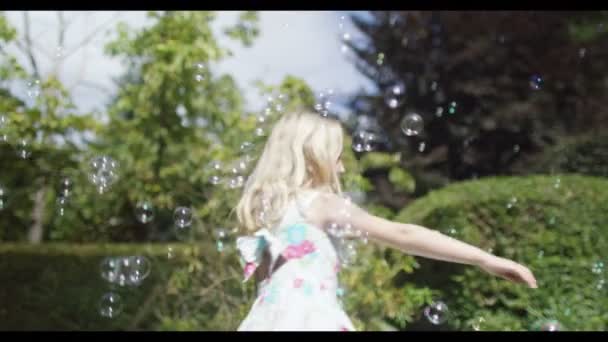 Girl  playing with bubbles — Stock Video