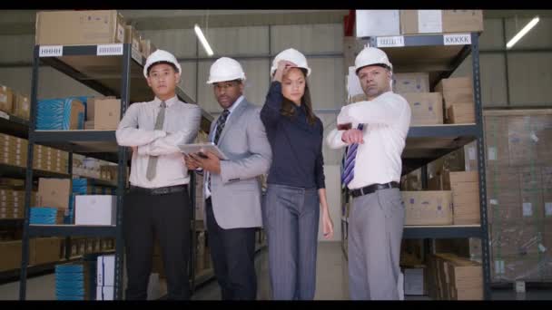 Management team in industrial warehouse — Stock Video