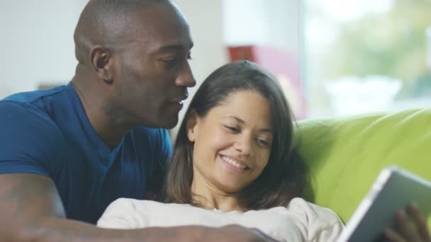 Couple relaxing with tablet — Stock Video