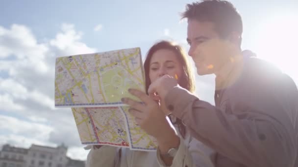 Couple looking at ma — Stock Video