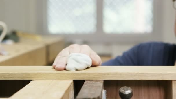 Carpenter putting the finishing touches to a piece — Stock Video