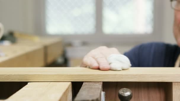 Carpenter putting touches to a piece of timber, — Stock Video