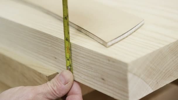 Carpenter measuring timber ready to be cut — Stock Video