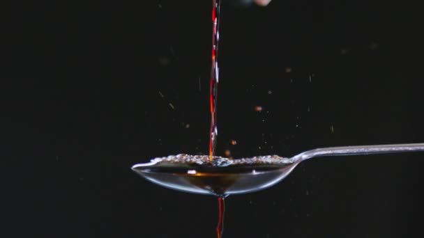 Balsamic vinegar poured onto spoon — Stock Video