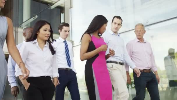 Business team walk outside office building — Stock Video