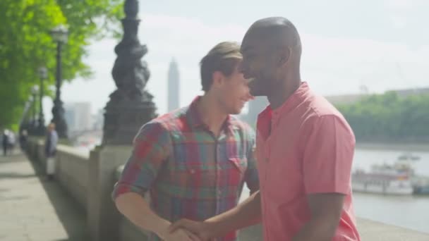 Friends meet up by the side of Thames — Stock Video