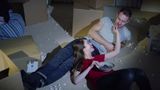 Couple  sitting  amongst  boxes — Stock Video