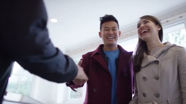 Couple with real estate agent looking at home — Stock Video