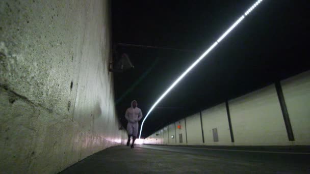 Athlete running through urban environment — Stock Video