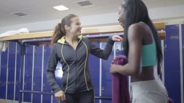 Women and high five in ladies' locker room — Stock Video