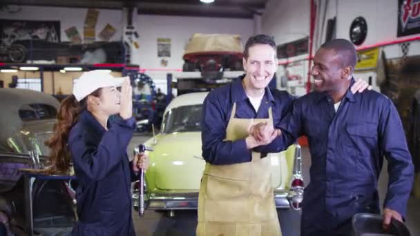 Mechanics in garage workshop — Stock Video