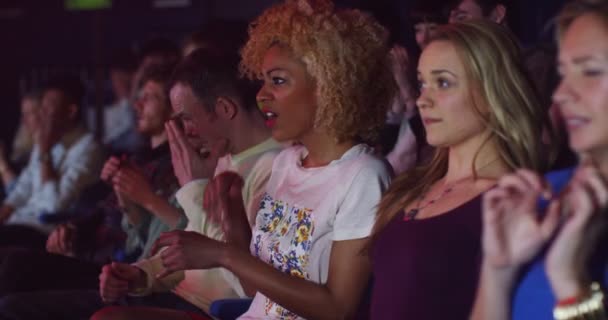 Audience looking disgusted by something — Stock Video