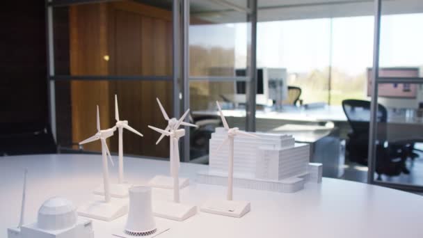 Wind turbines on a desk in office — Stock Video