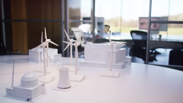 Wind turbines on a desk in office — Stock Video