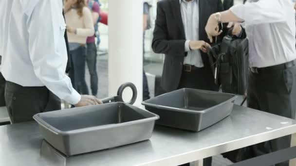 Airport security guards searching passengers — Stock Video