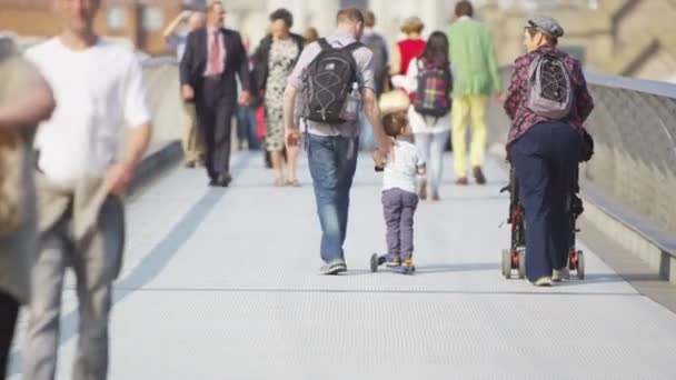 People crossing the Millennium footbridge — Stock Video