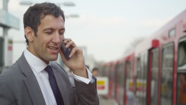 Businessman talking on his cellphone — Stock Video