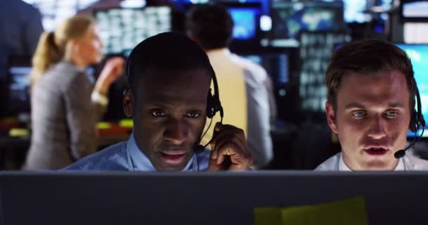 Surveillance team working in control room — Stock Video