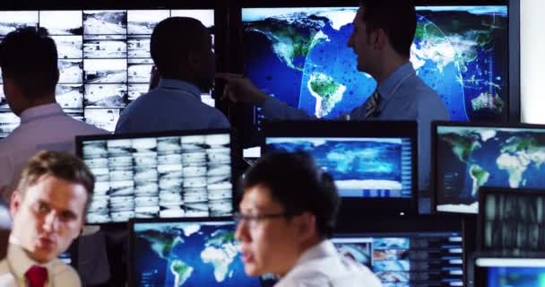 Surveillance team working in control room — Stock Video