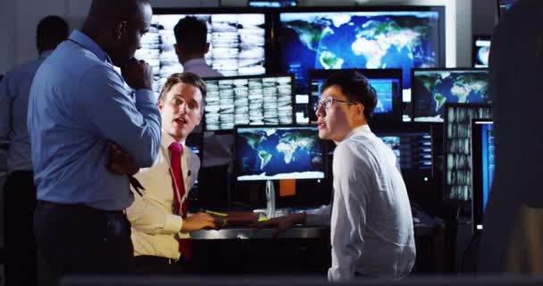 Surveillance team working in control room — Stock Video