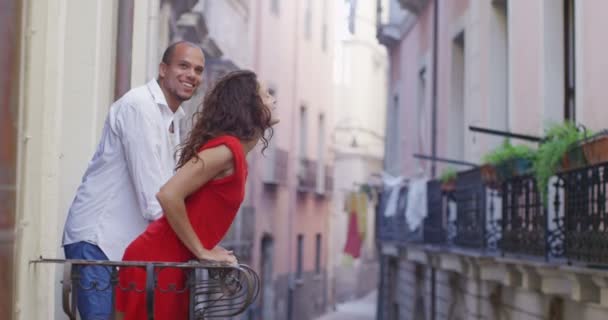 Couple go out onto the balcony — Stock Video