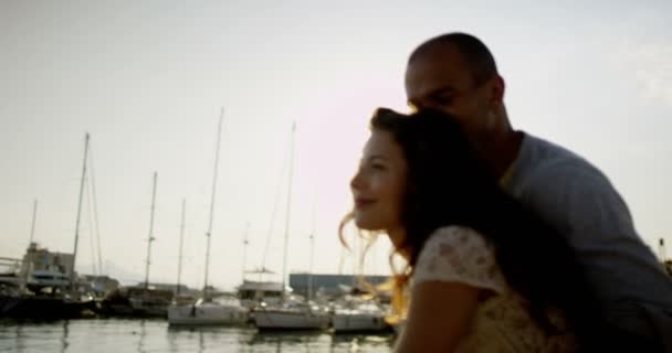 Couple looking at the boats in the harbour — Stock Video