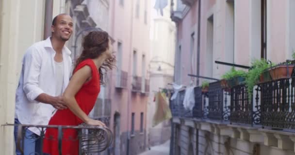 Couple go out onto the balcony — Stock Video