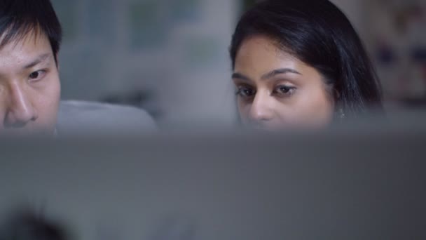 Businessman and businesswoman working at a computer — Stock Video