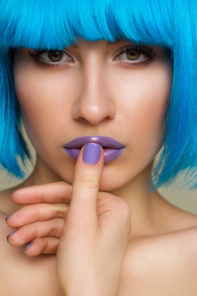 Portrait of beautiful sexy fashion model in blue wig
