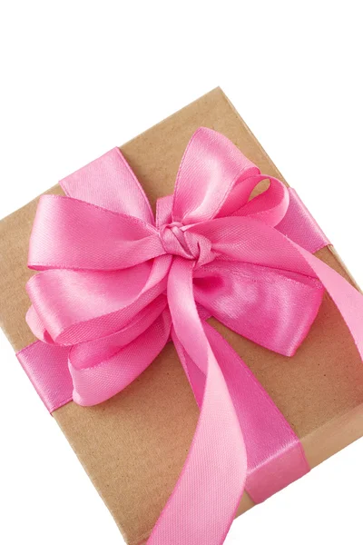 Picture of a gift wrapped in pink ribbon over isolated backgroun — Stock Photo, Image