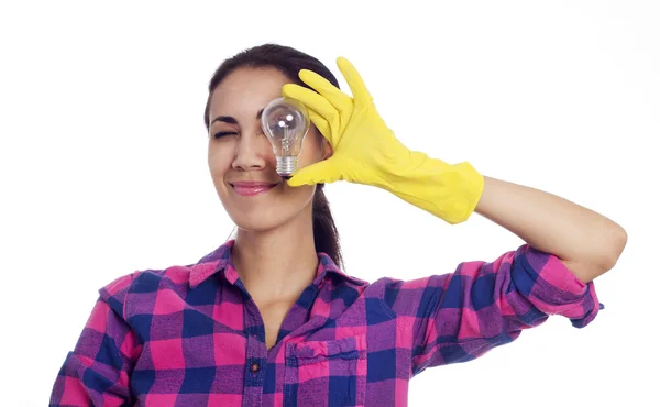 Woman in cleaning gloves with light bulb — Stock Photo, Image