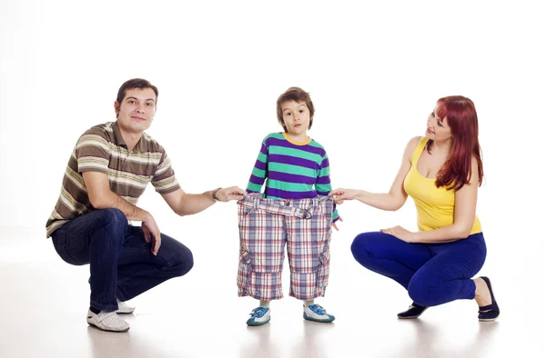 Parents with their son in big pants — Stock Photo, Image