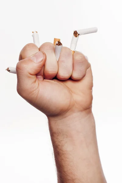 Hand crushing cigarettes — Stock Photo, Image