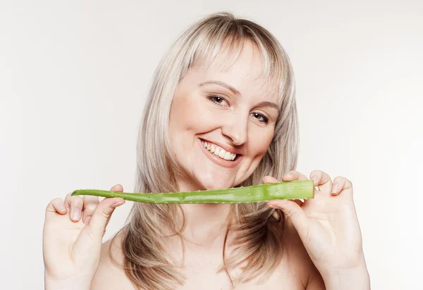 Young beautiful woman with aloe — Stock Photo, Image
