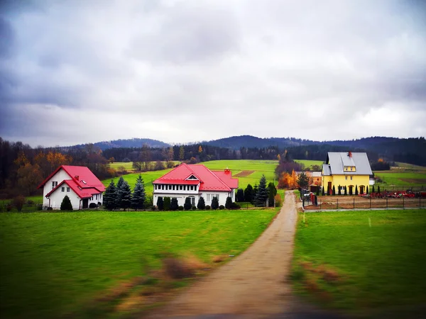 The view of european houses over road while driving