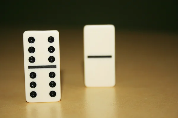 Close up picture of dominos, one from the crowd — Stock Photo, Image
