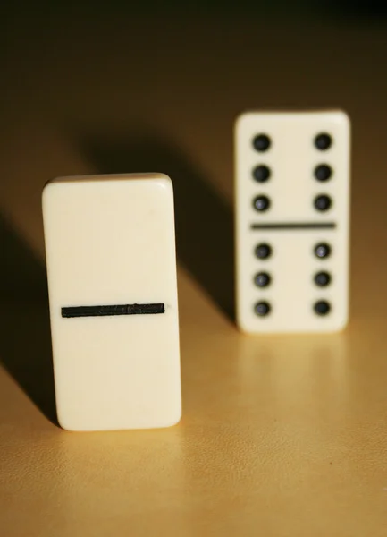 Close up picture of dominos, one from the crowd — Stock Photo, Image