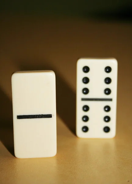 Close up picture of dominos, one from the crowd — Stock Photo, Image