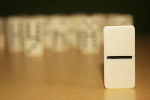 Close up picture of dominos, one from the crowd — Stock Photo, Image