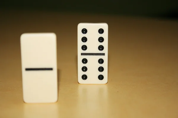 Close up picture of dominos, one from the crowd — Stock Photo, Image