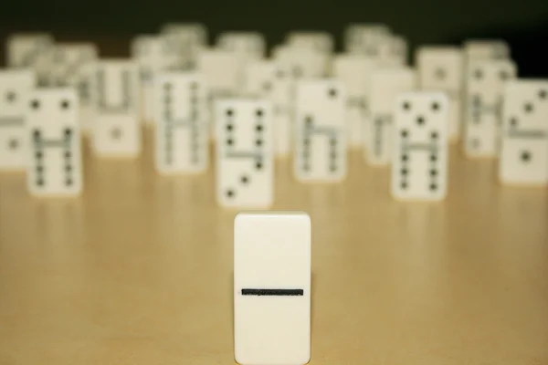 Close up picture of dominos, one from the crowd — Stock Photo, Image