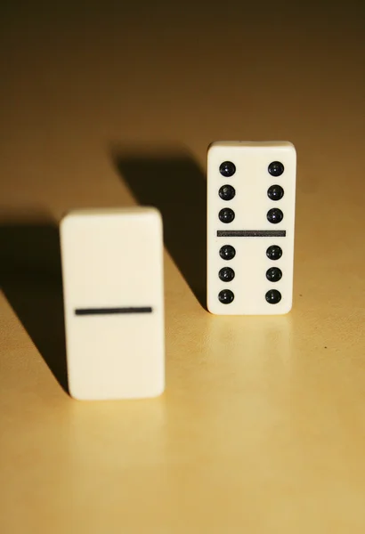 Close up picture of dominos, one from the crowd — Stock Photo, Image